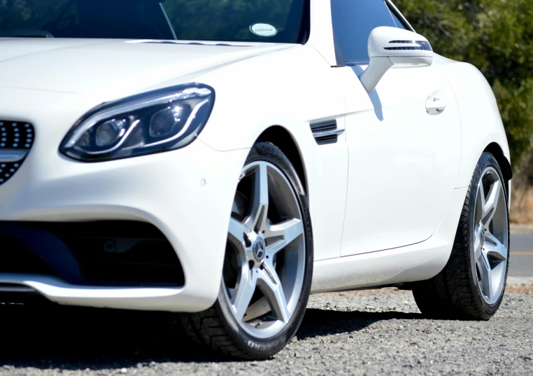 a car that is parked in the gravel