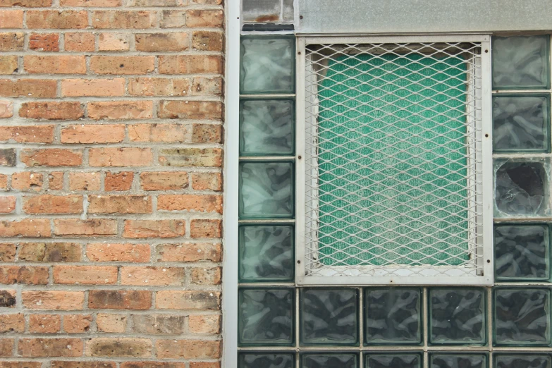 a brick building with glass blocks around the window