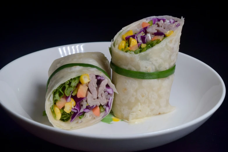 two different types of vegetables wrapped in tortillas