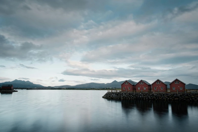 a dock that has a bunch of small houses on it