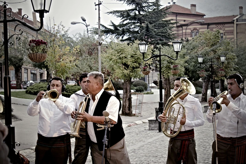 a band that is playing music outside of a building