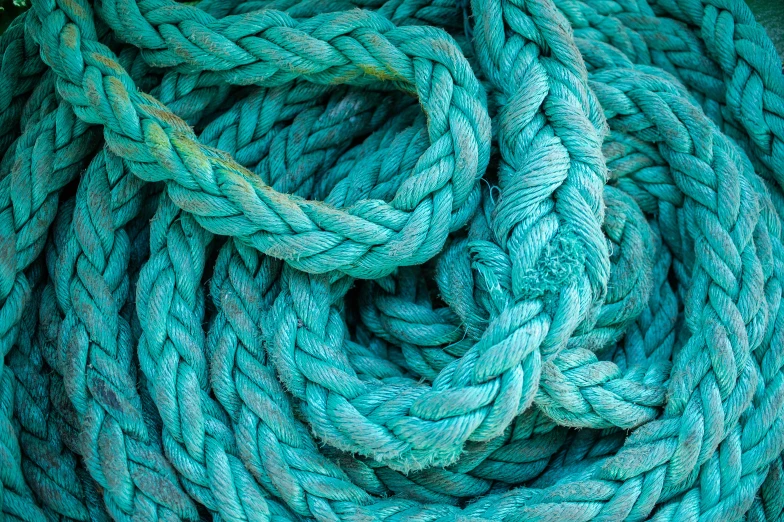 a blue rope is curled up into a loop