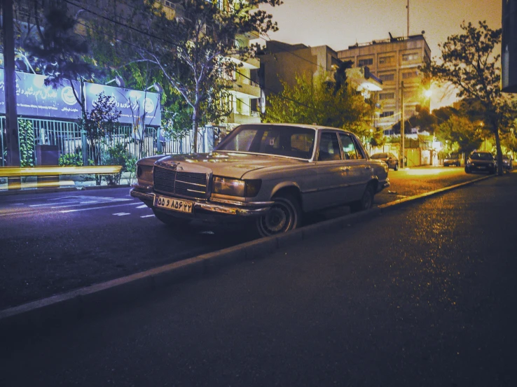 a car is parked on the side of a street