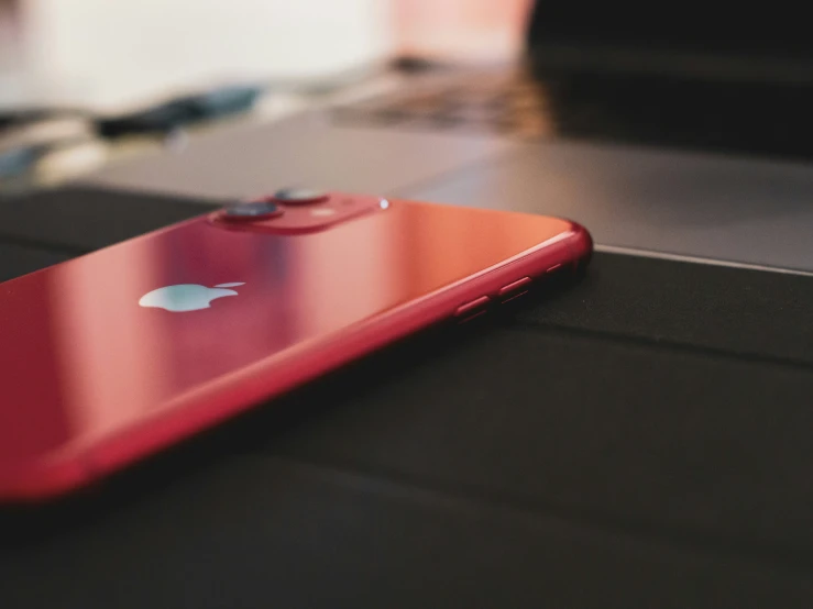 an iphone is shown on a desk closeup
