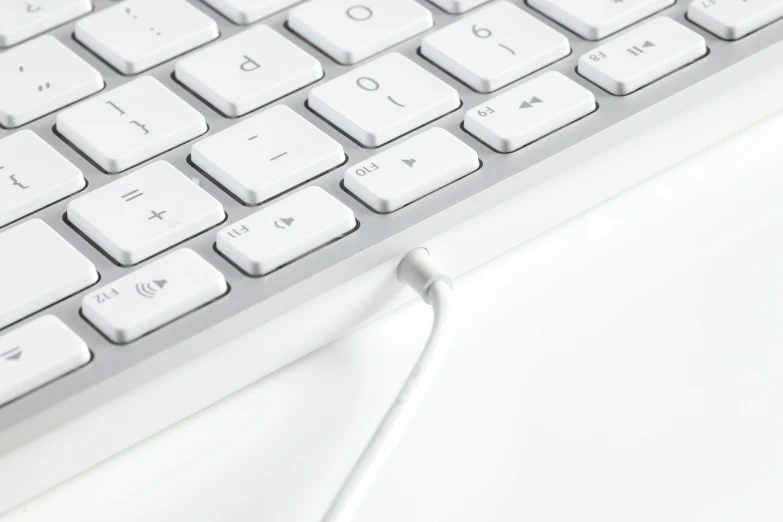 a close up of a white computer keyboard