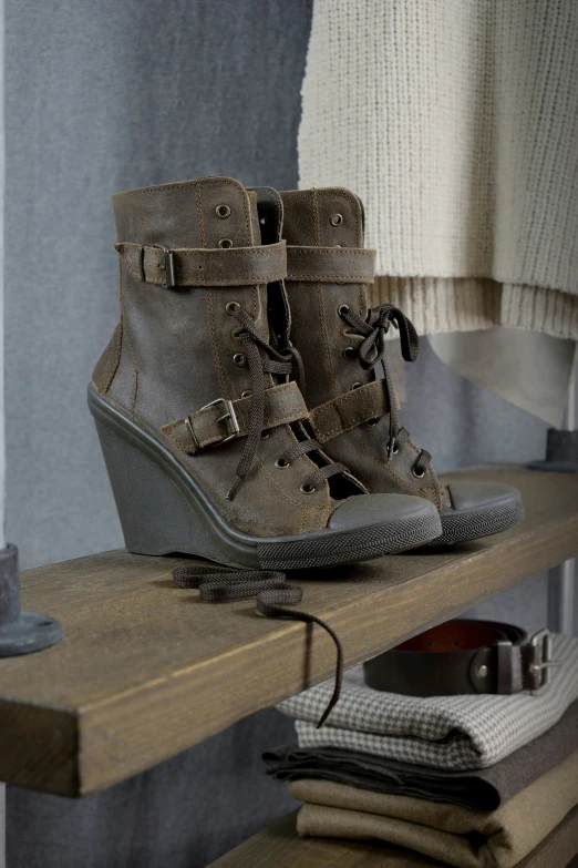 a pair of shoes is sitting on a shelf