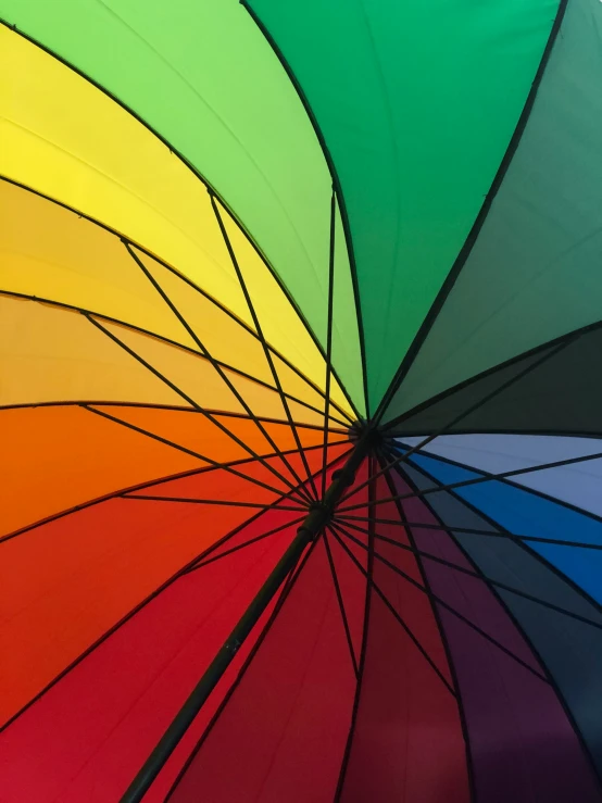 an open umbrella is shown in multicolored lines