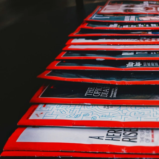 a row of books that are sitting on a table