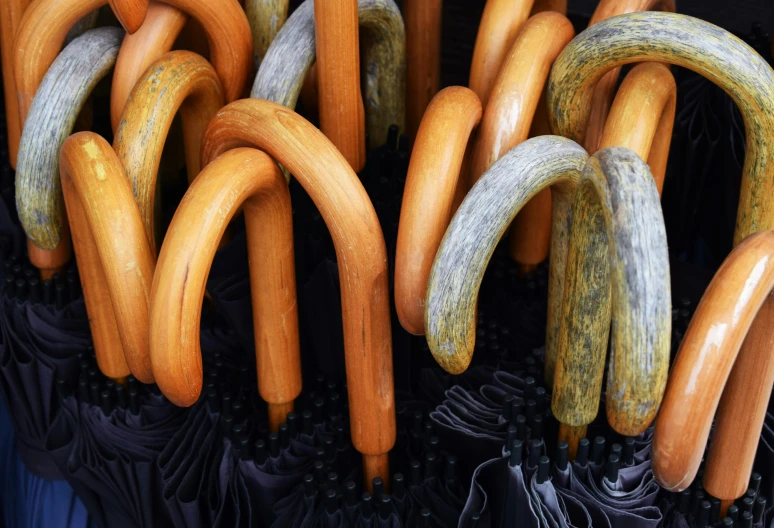 a close up of many different colored wooden handles