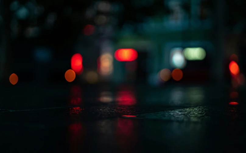 blurred street lights and blurry traffic in an urban area