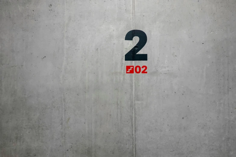 two different colored numbers on a wall