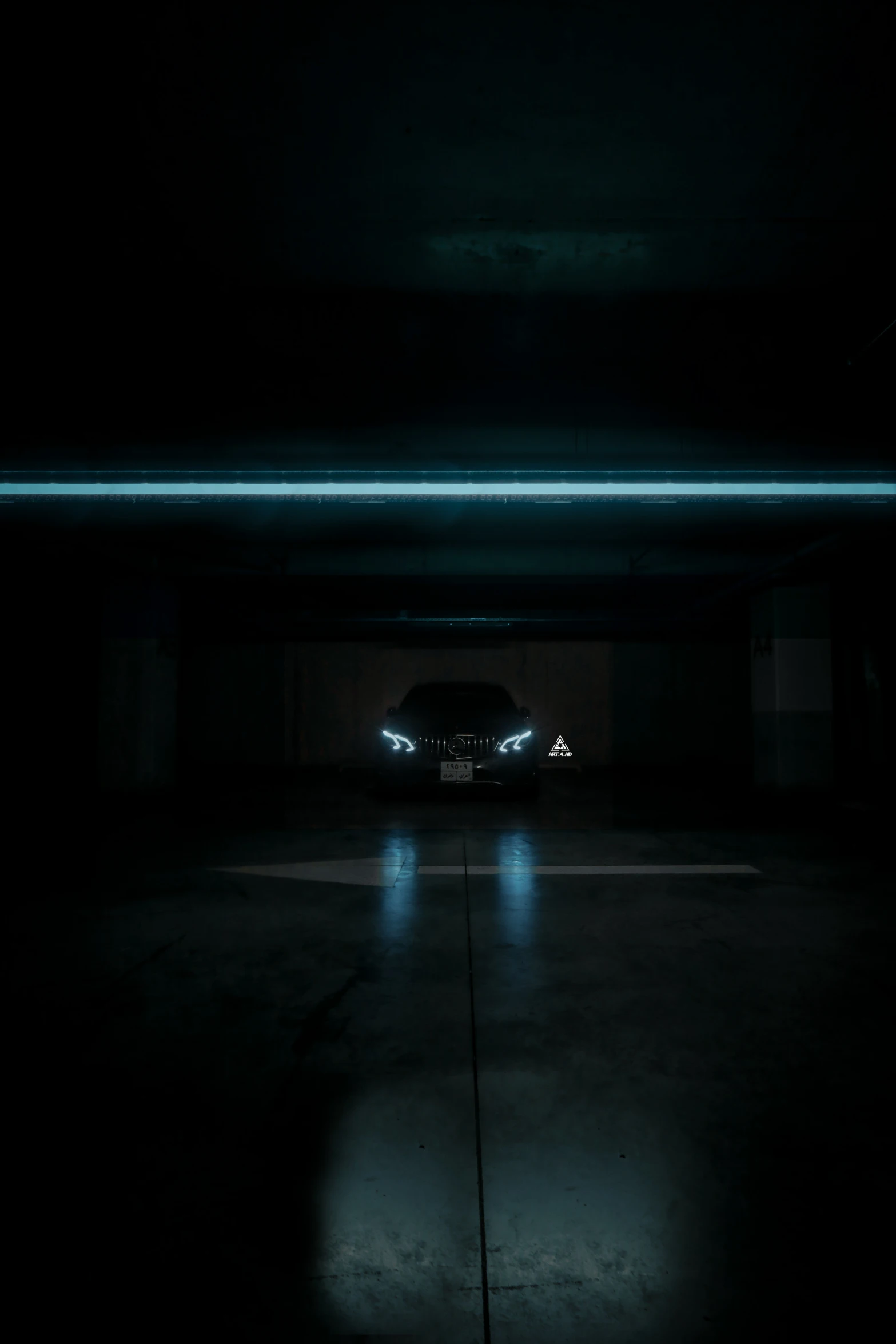 a dark garage with a car parked next to it at night