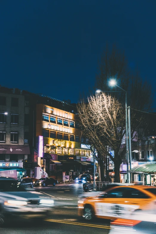 a busy street at night during the winter