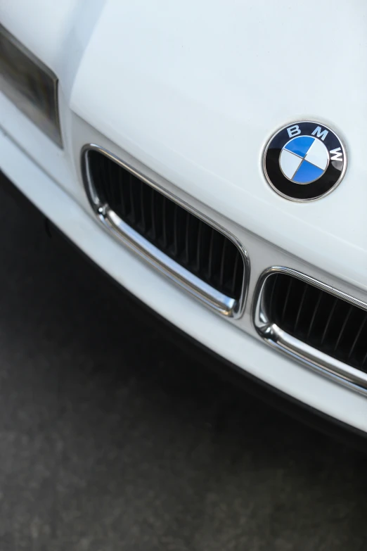 bmw emblem on the front of a white car