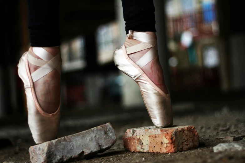 two ballet feet, and there is a brick near the end