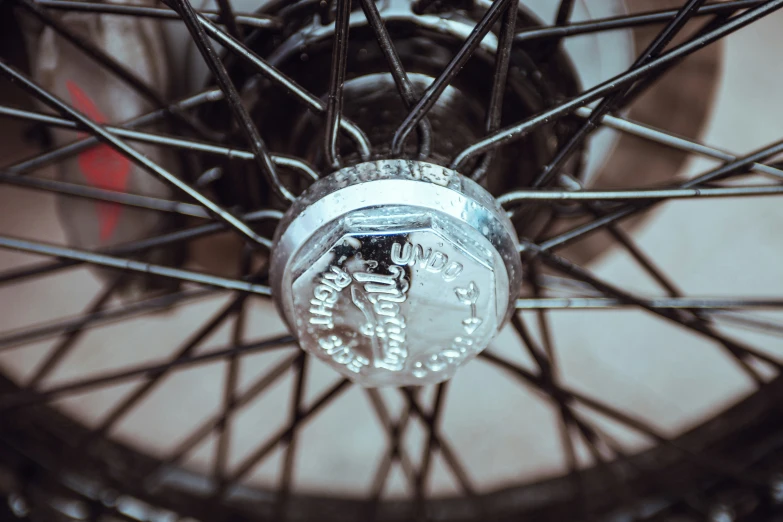 a spokes wheel with some words hanging from it