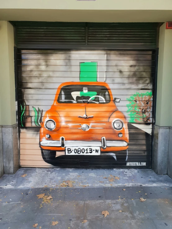 an orange car is painted on the garage door of this home