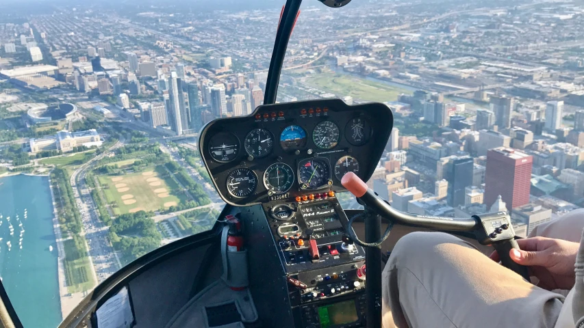 a person is sitting in the cockpit of a plane