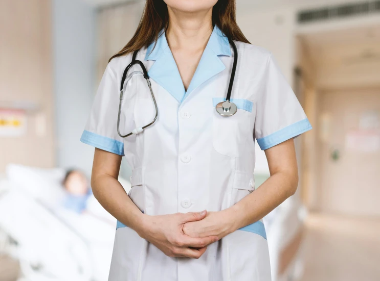 a nurse standing in a hospital room