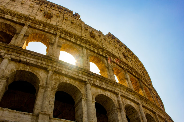 the sun is seen through some window arches