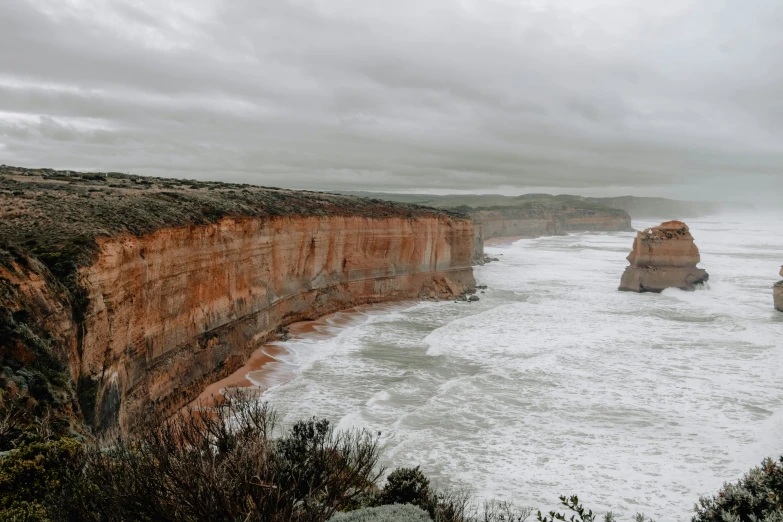 the cliffs have a body of water below them