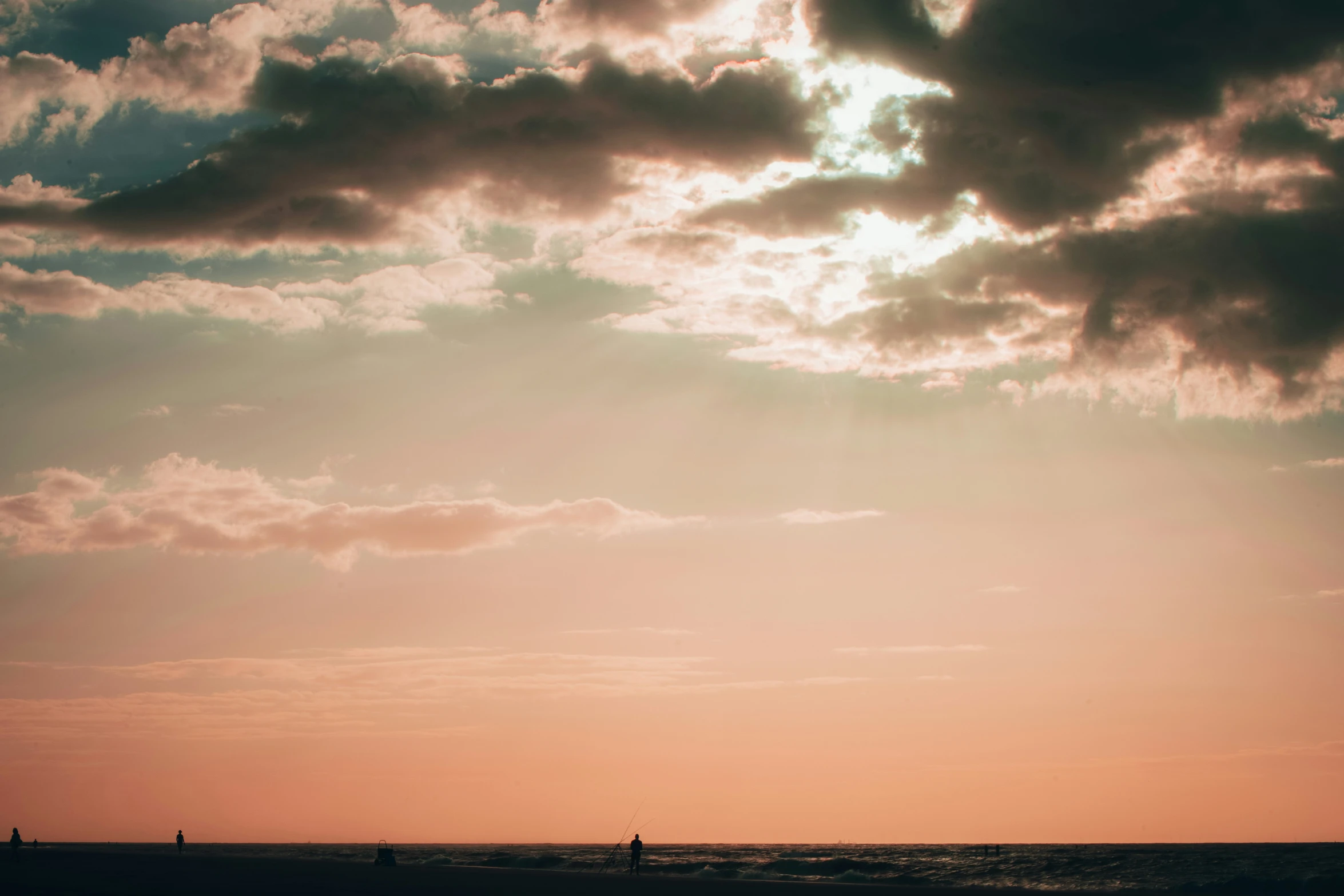 a person surfing a wave at sunset on a sunny day