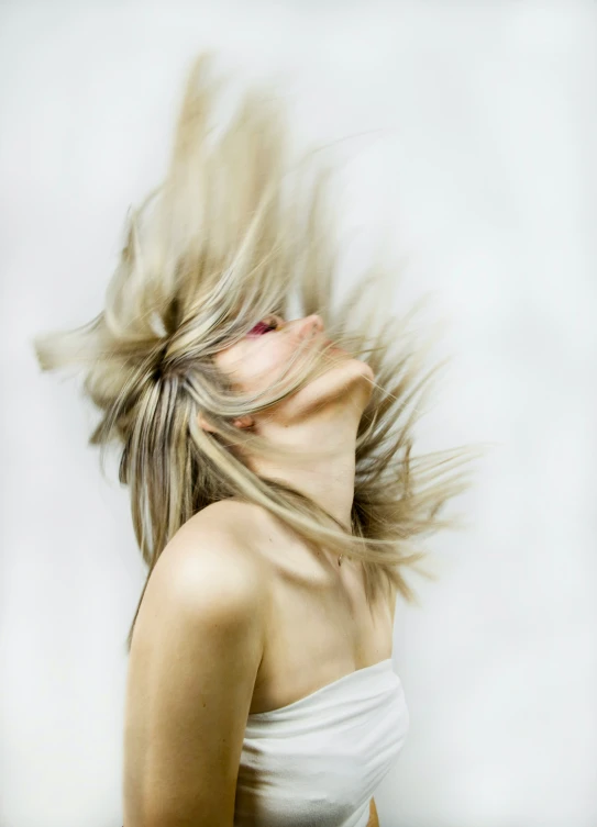 woman with long blonde hair blowing in the wind