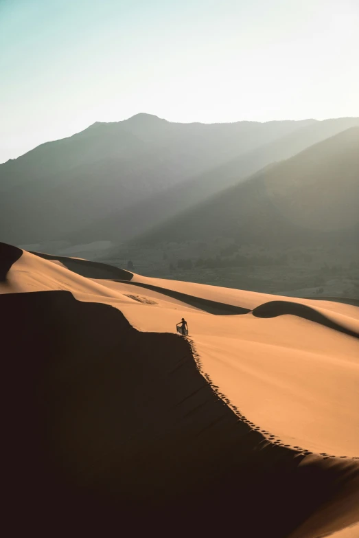 a lone motorcycle is traveling through the desert