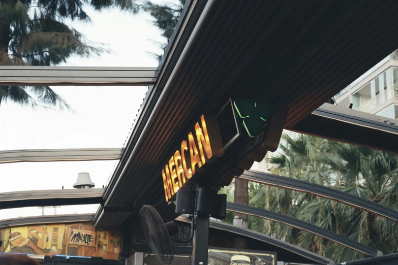 a sign saying a train stop sitting in front of a platform