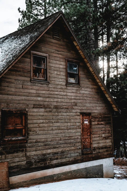 a large house that is outside in the snow