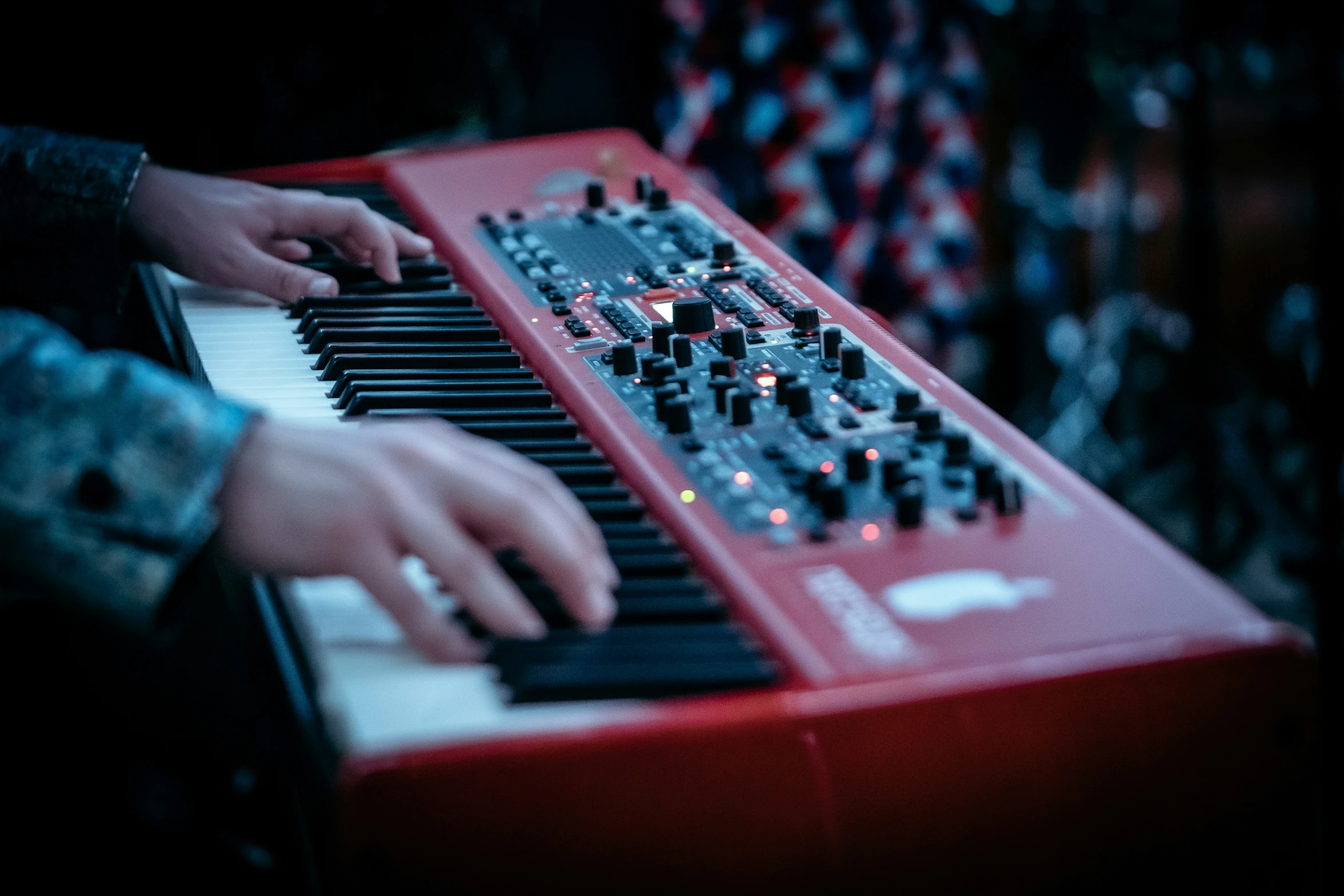 a man playing the piano and touching his finger