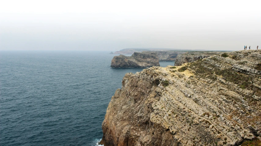 the view of a cliff overlooking the ocean