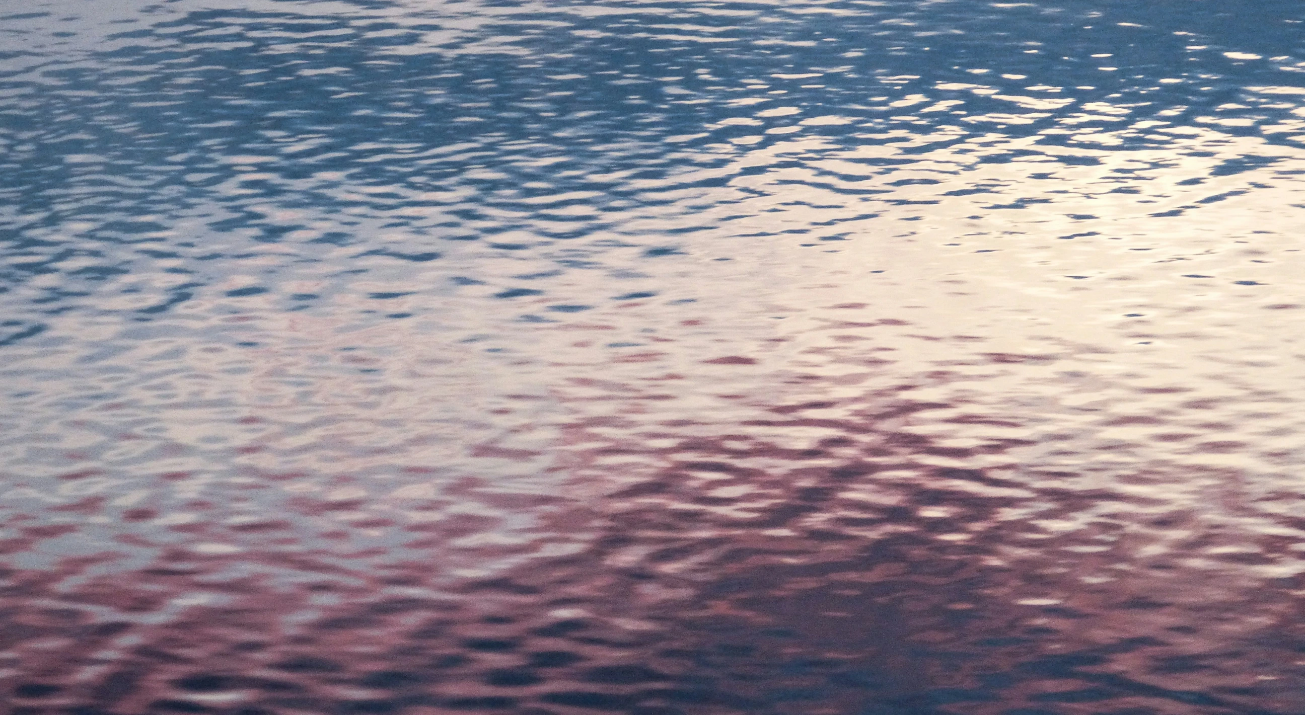 a large body of water with waves in it