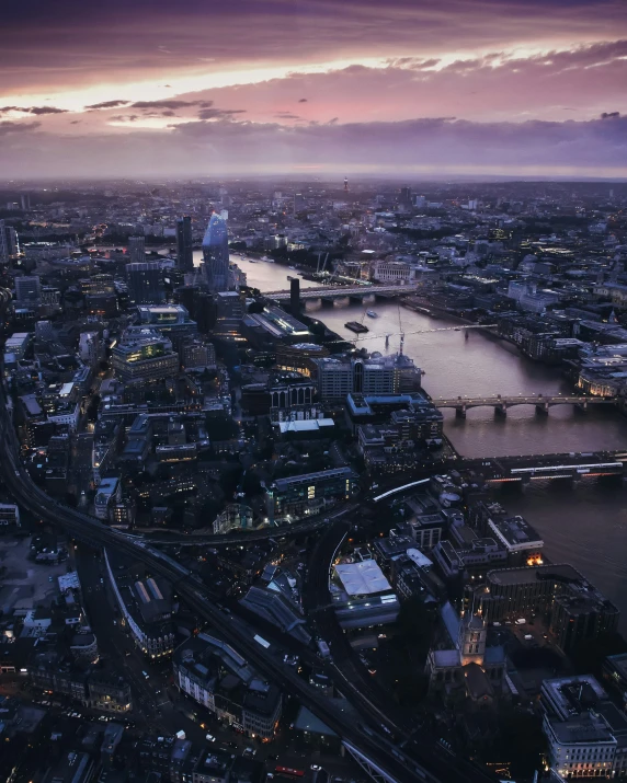 a city view at dusk of buildings near water