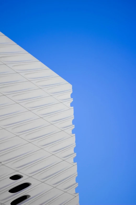 the silhouette of a building is visible from below