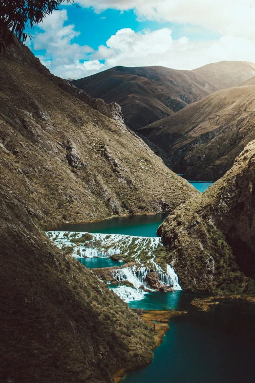 a lake surrounded by a mountain landscape