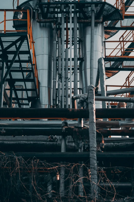 pipes and stairs are connected to the top of a structure