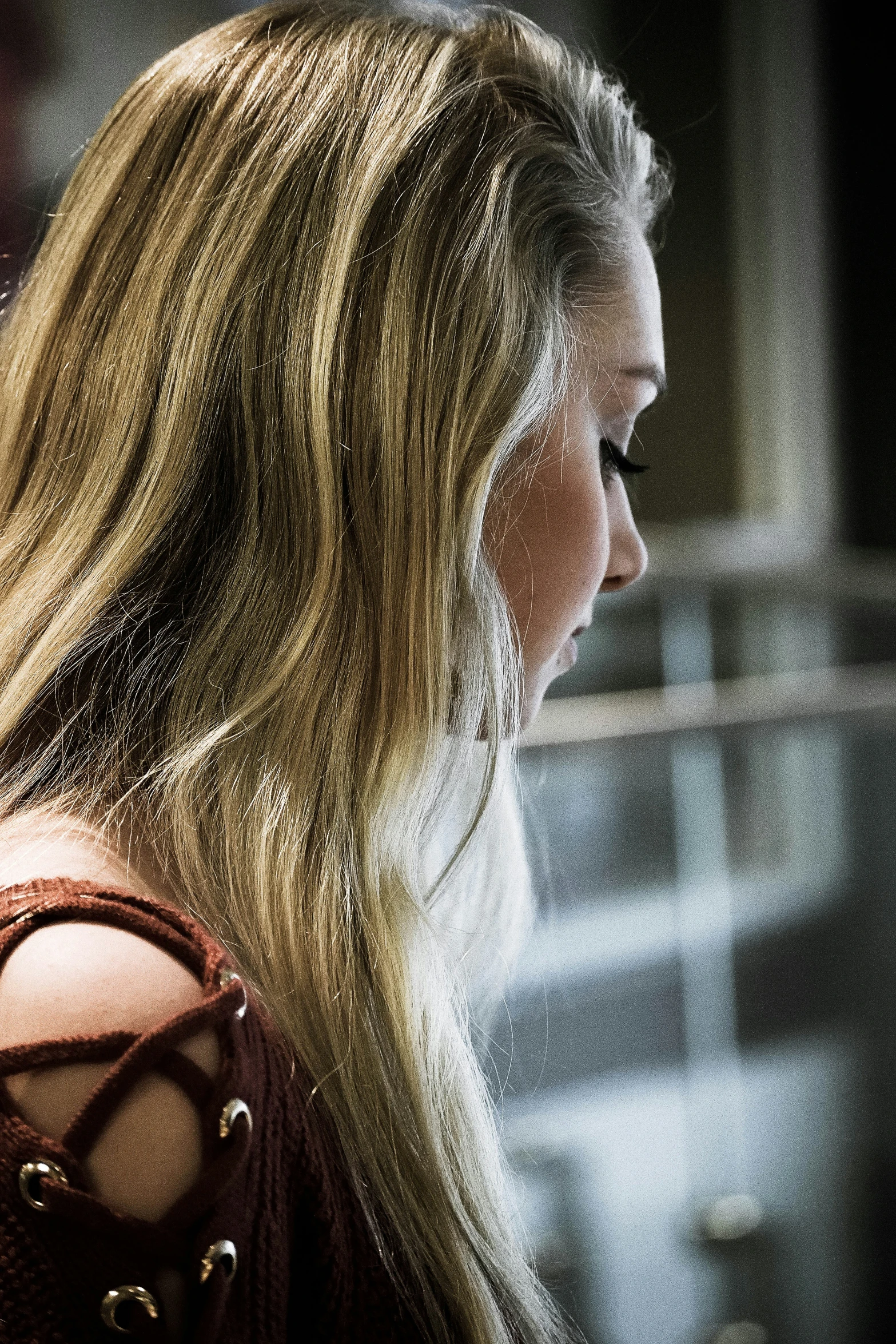 long hair and a red top make this young lady an ultimate woman