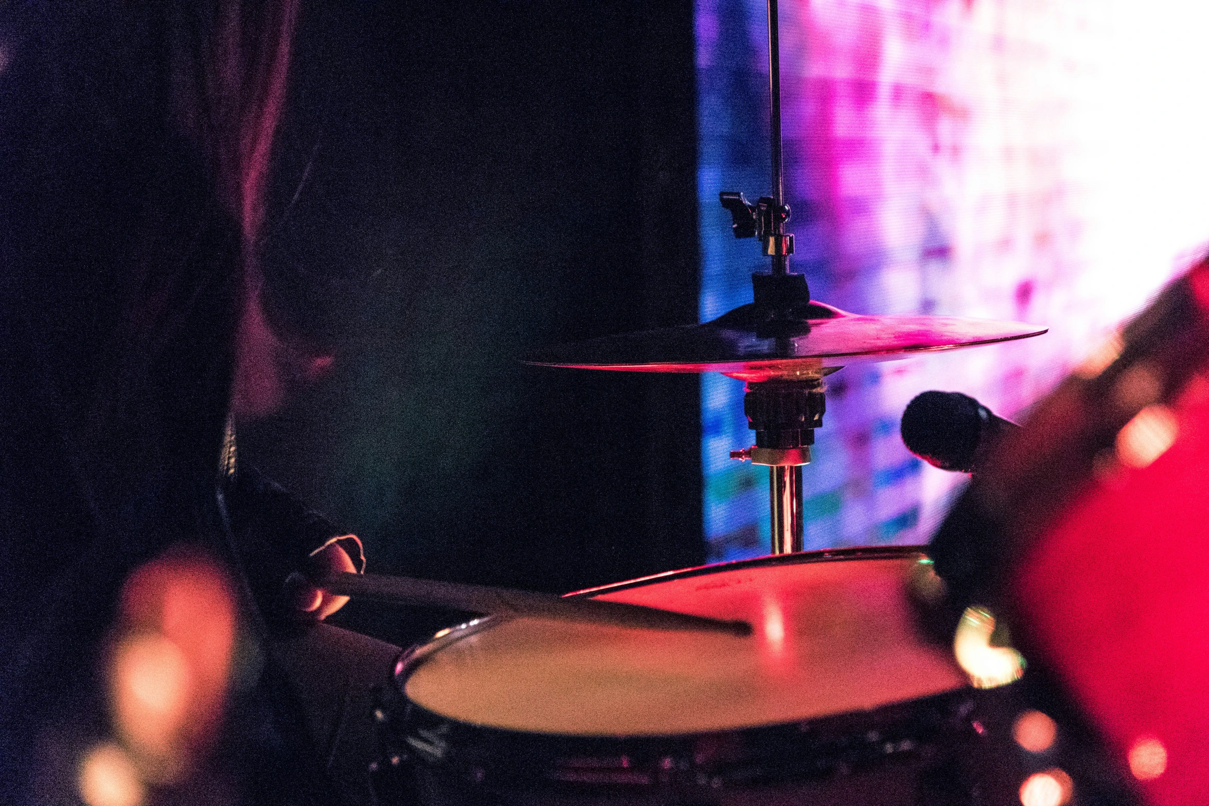 a drums set up on a stage with lights