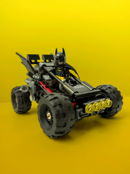 a lego batman car is sitting on the floor