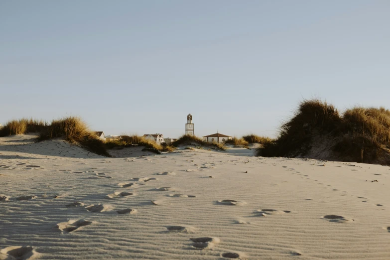 the sand is soft with footprints on it