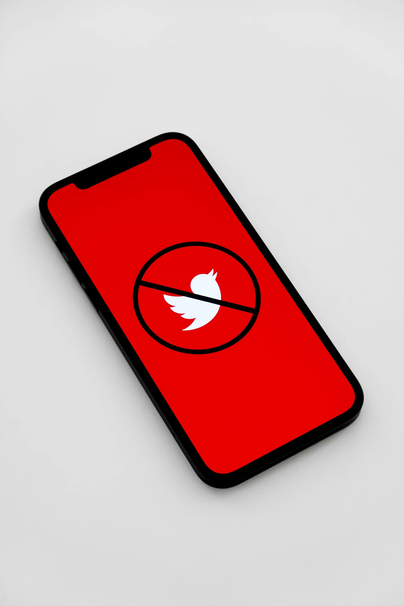 the back of an iphone showing a red, curved logo