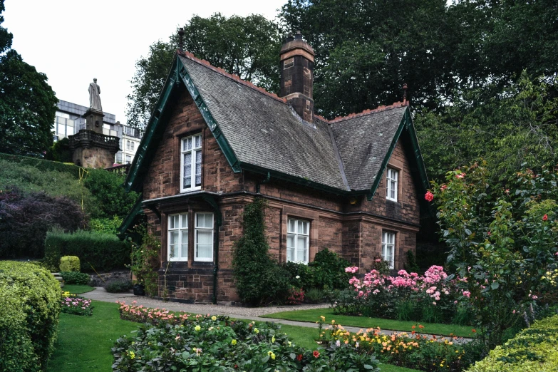 an old home with landscaping and hedges