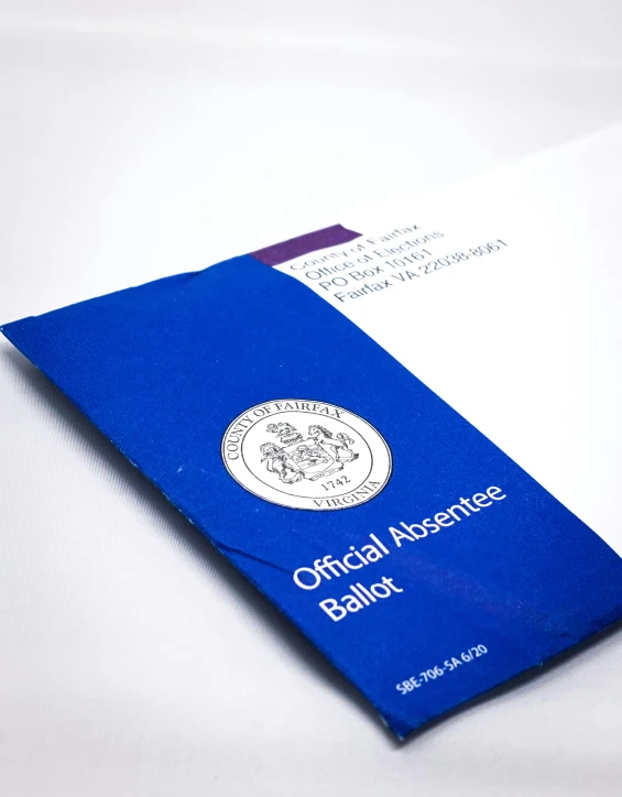 a blue official balance book with a red envelope