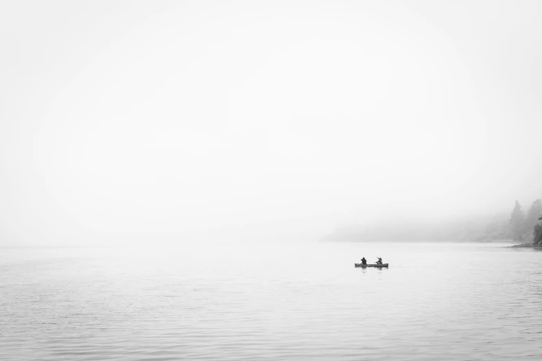 there are two people in the boat in the water