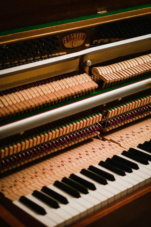 closeup s of a piano with several long piano keys
