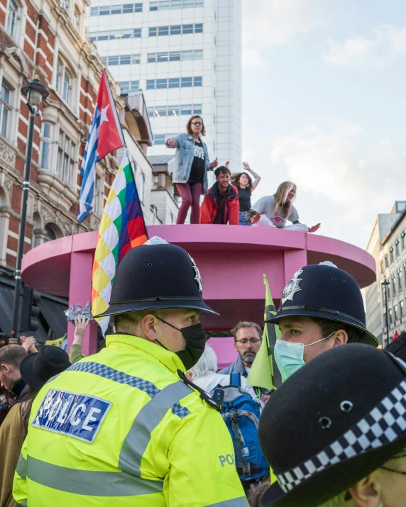 a group of people with police helmets and some people