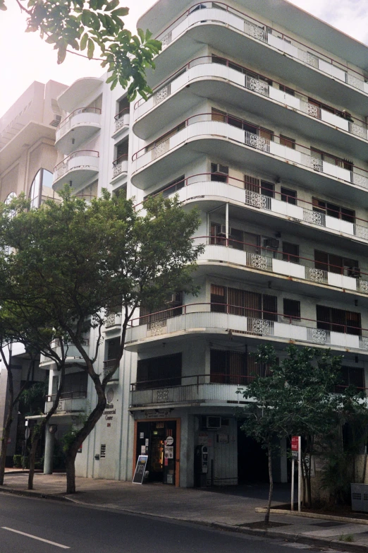 an apartment building in a quiet neighborhood in the evening