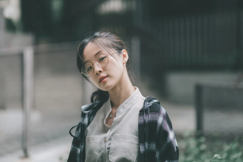 a woman standing on the side of a street with an arm around her shoulders