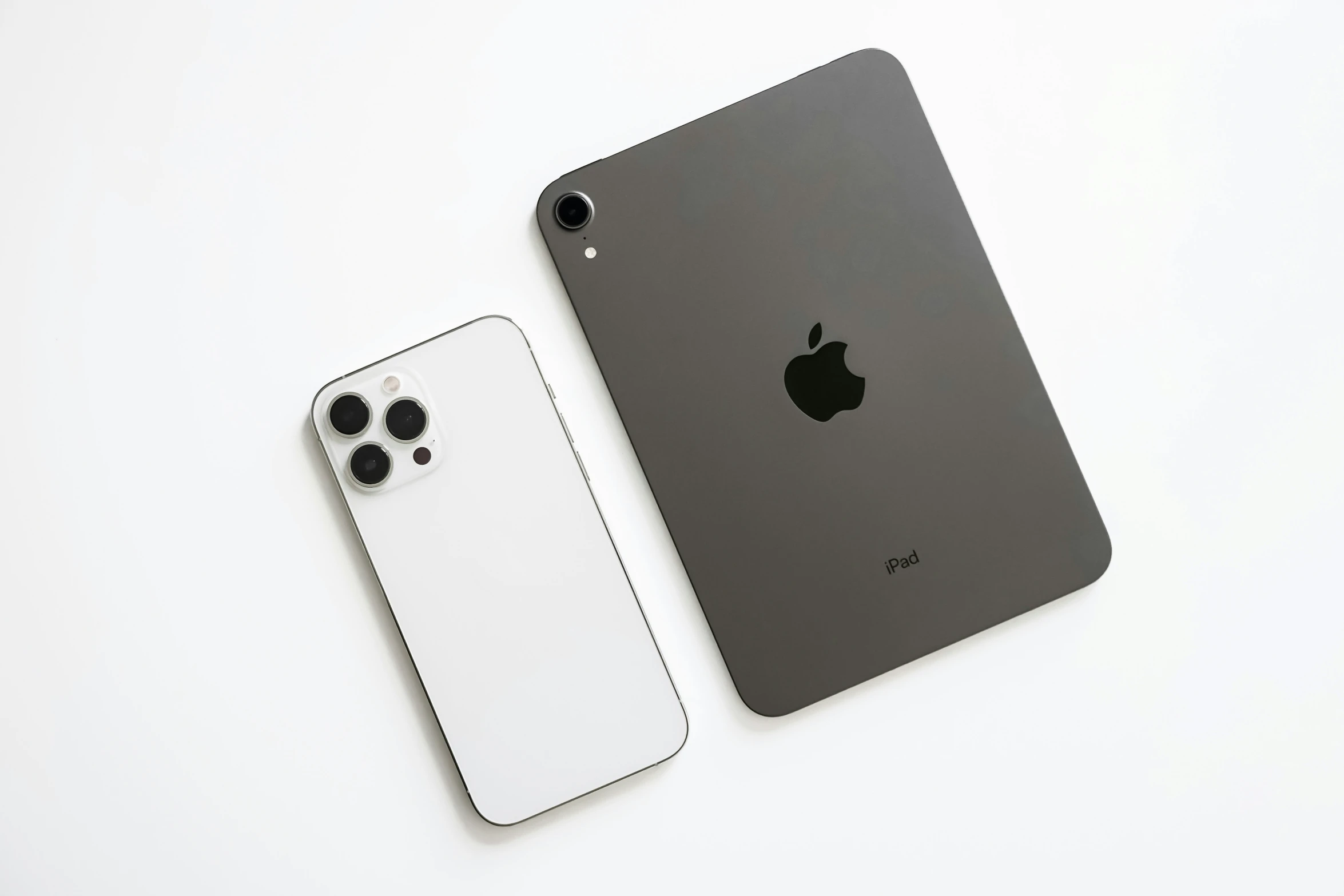 an ipad pro left and a iphone 11